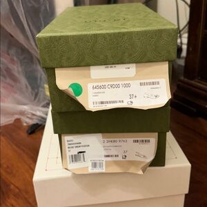 Two empty Gucci shoe boxes